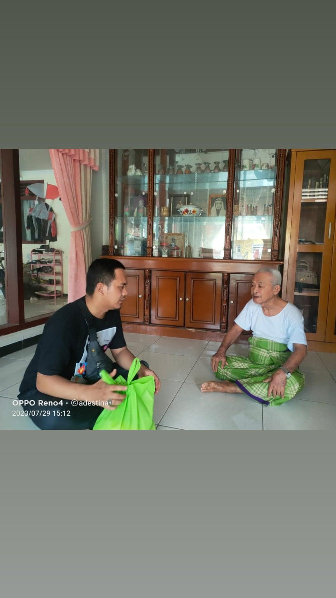 Visiting an elderly man at his home with a bag of supplies