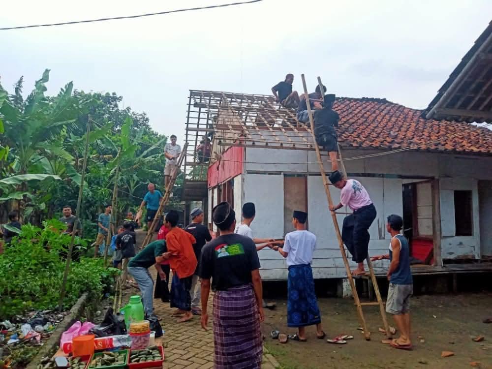 Community members rebuilding a roof together