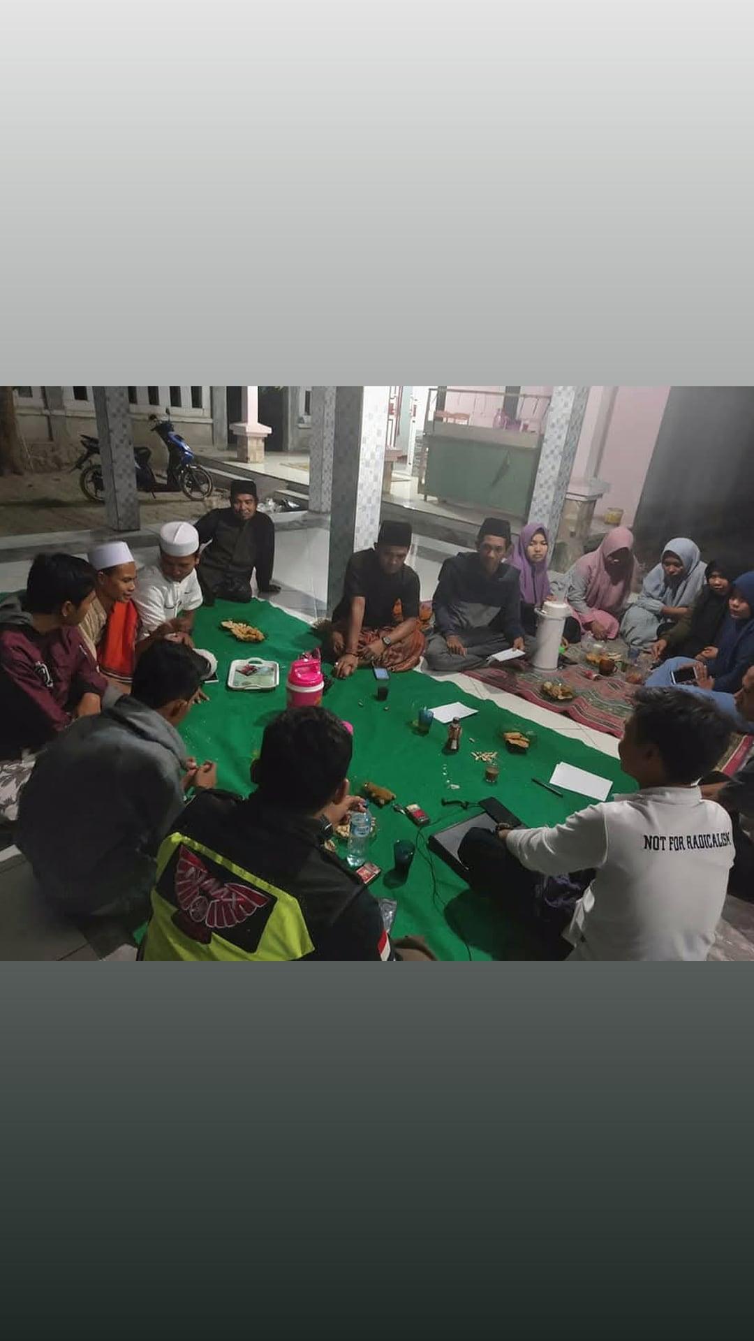 Community members in a planning meeting on the floor